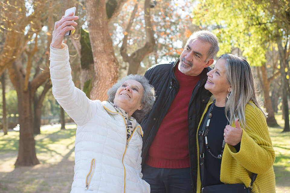 retired friends taking selfies